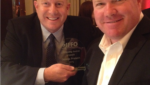 Omega Protein CEO Bret Scholtes and Travis Mayer with the 2015 IFFO Leadership Award