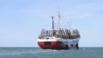 Large jigger vessel heading out to catch squid. Credit: buenaventura/Shutterstock.com