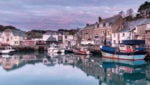 Dawn at the harbor in Padstow an historic fishing town on the north Cornwall coast, UK. Credit: Helen Hotson/Shutterstock.com