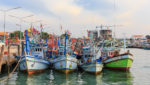 Thai fishing boats in port in Sattaheep Chonburic. Credit: jack_photo/Shutterstock.com